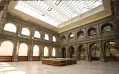 Interior view of a room of the Prado Museum extension, showing the glazed roof and the room with porticos