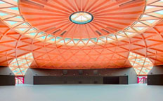 Interior view, showing the orange roof, of the new Les Arenes leisure centre